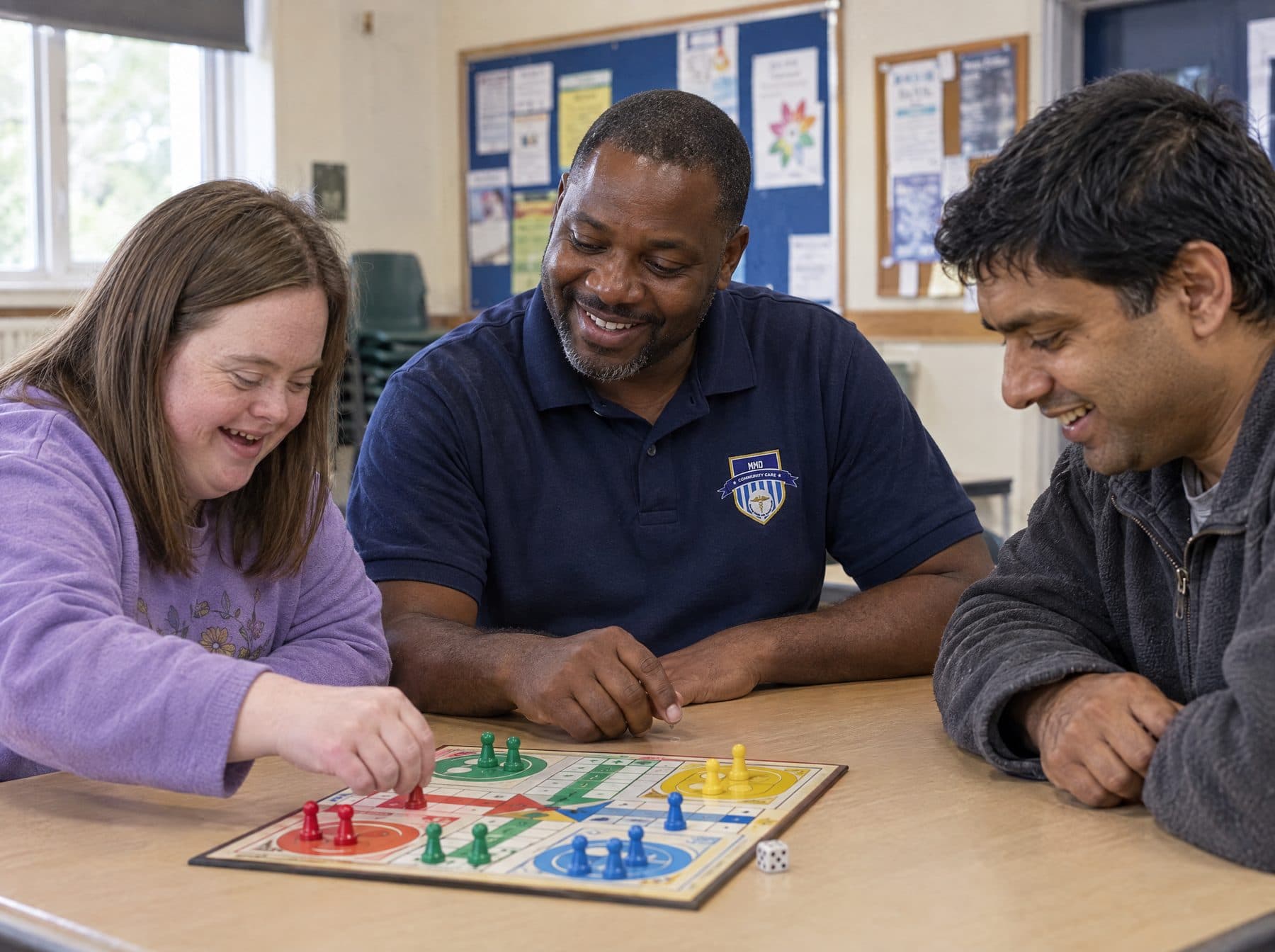 An MMD support worker accompanying a client in the community